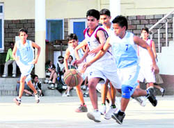 A match of the District Youth Basketball Championship in progress in Dehradun on Wednesday