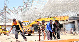 Labourers at work at the new terminal building of Chandigarh airport.