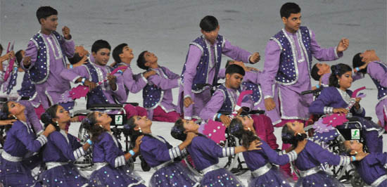Disabled children perform during the closing ceremony of the Commonwealth Games at the Jawharlal Nehru Stadium in New Delhi