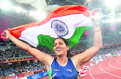 Krishna Poonia after wining the gold in women's discus throw at the New Delhi Commonwealth Games.