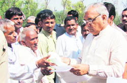 Chief Minister Bhupinder Singh Hooda listens to peoples grievances in Rohtak