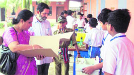 Students of Gita Niketan Awasiya Vidyalaya display their exhibits in a science fair in Kurukshetra.