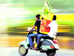 Youths ferry part of an effigy to be set aflame on Dasehra, in Bathinda on Thursday