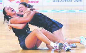 New Zealand players celebrate after beating Australia to clinch gold in womens netball event in New Delhi on Thursday. 