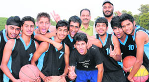 Winners of the U-19 Inter-School Basketball Championship in a jubilant mood at the Sector 46 stadium in Chandigarh on Friday.