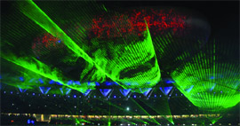 A laser show illuminates the Jawaharlal Nehru Stadium during the Commonwealth Games closing ceremony in New Delhi on Thursday night. Artistes perform at the ceremony. 