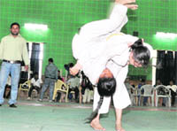 Two judokas battle it out at the District Girls Judo Competition in Dehradun 
