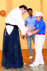 Karate instructor Allen Woodman gives tips to a school student in Ludhiana on Friday.