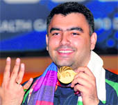 Gagan Narang poses with his gold medal for the 50 m Rifle 3 Positions shooting. Narang won four gold medal at the Games