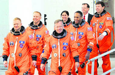 The crew of Discovery on way to board the space shuttle during a launch dress rehearsal at the Kennedy Space Center in Cape Canaveral on Friday. Discovery is scheduled for a November 1 launch. 