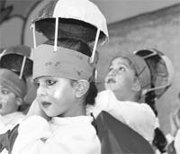 Tiny tots of Satpal Mittal School perform on the annual function in Ludhiana on Saturday. 