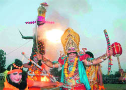 An effigy of Ravana goes up in flames as an artiste, enacting the role of the demon king, bursts into a loud laugh at the Sector 17 