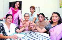 Members of the Sahayata Cancer Sahyog strike a pose at their office in Sector 15, Chandigarh.