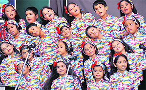 Students participate in a singing competition at Carman School in Dehradun on Friday.