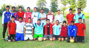 Members of the football team pose for a photograph.