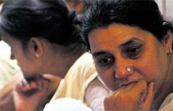 Grieving relatives of Arvind and Atul