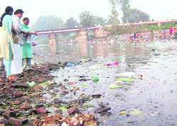 Devotees immerse sanjhi in the Bathinda branch of the Sirhind canal near Ahmedgarh on Sunday