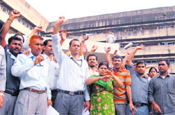 Members of the contractual staff protest outside the medical superintendent office at the PGI seeking strict action against the doctor who allegedly slapped lab attendant Muneesh