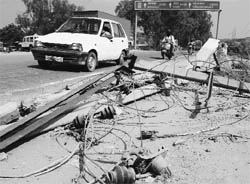 Damaged electricity poll lies along the Ramgarh-Majri chowk road in Panchkula which may cause an