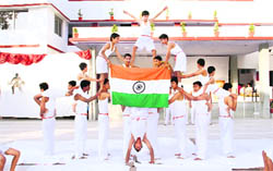 Students perform at the junior sports day of the Childrens Academy in Dehradun on Monday.