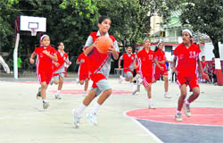 A match in the Tek Chand Memorial Basketball Tournament being played in Dehradun on Monday. 