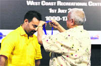 Californian Governor presents the award of excellence to Amit Swami. 