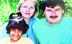 A file photo of Laura when she was adopted by the Swiss couple.