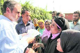 Chief Minister Omar Abdullah listens to grievances of people at a public darbar in Srinagar