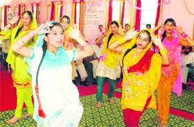 Students give a performance at a function at Government Girls Higher Secondary School in Shastri Nagar in Jammu