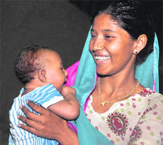 A jubilant Laxmi reunited with her six-month-old baby in Ludhiana on Monday.