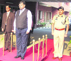 Justice MM Kumar (c) of the Punjab and Haryana High Court inspects the guard of honour during his visit to Ludhiana on Monday. Sessions Judge SP Bangarh (left) and Commissioner of Police Ishwar Singh are also in the picture.
