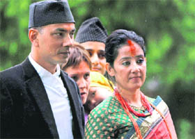 Actor Manisha Koirala and husband Samrat Dahal wait to receive blessings from ex-King Gyanendra during the Dashain festival in Kathmandu on Sunday