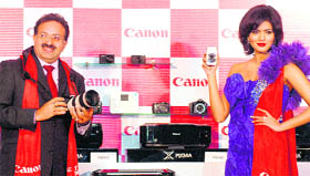Canon India Senior Vice President Alok Bhaaradwaj (L) at the launch of the 60D SLR Disital Camera. Twenty two high-definition consumer digital and imaging products of the company like cameras and photo printers were launched on Tuesday.