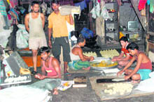 Workers make sweets in Industrial Area, phase V, under unhygienic conditions.