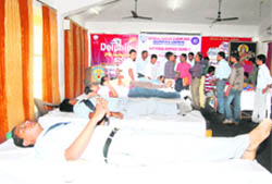 Volunteers donate blood at a camp in Dehradun