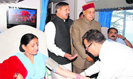 A donor donates blood inside the blood donation van in Shimla on Tuesday.