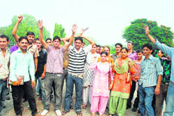 Activists of the National Secular Forum protest against the selection list of patwaris released recently in University of Jammu