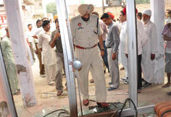 After firing the DSP city inspects the ransacked shop in Bathinda on Tuesday