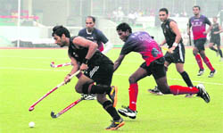 A match in progress between Air India, Mumbai and Air Asia, Malaysia at Olympian Surjit Stadium in Jalandhar