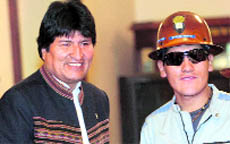 Bolivias rescued miner Carlos Mamani (right) with President Evo Morales at the presidential palace in La Paz on Tuesday.