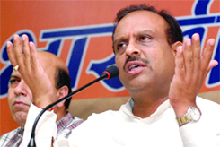 Delhi BJP chief Vijendra Gupta demands Chief Minister Sheila Dikshits resignation at a press conference in New Delhi on Wednesday.