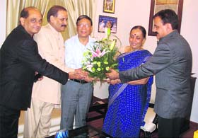 Newly appointed Chief Information Commissioner NS Napalchayal and two other Information Commissioners meet Governor Margaret Alva in Dehradun