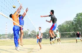 A match in progress at the District Volleyball Championship in Dehradun
