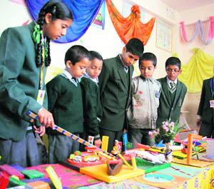 Students of BSN School explain their exhibits during a craft exhibition in Shimla on Wednesday.