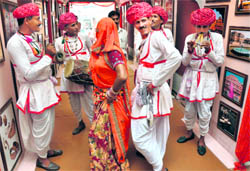 Artistes give a performance during the opening ceremony of a two-day mini-Rajasthan festival in Jammu on Wednesday