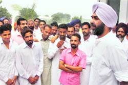 Manpreet Badal with his supporters at Badal village