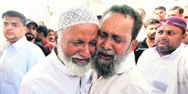 Grieving relatives of a victim in Karachi on Wednesday.
