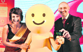 Vodafone Operations Director Sanjoy Mukherjee with Mandira Bedi at an event to demonstrate the working of the companys 3G services in New Delhi on Thursday. The company will launch 3G services in the country early next year.