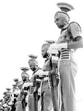 Punjab Police personnel pay tributes to martyrs during the Commemoration Day parade at the Sector-17 police station in Chandigarh on Thursday