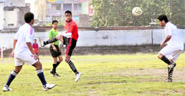 Players of New Gypsy Club and Football Hostel in action at a semifinal clash of the DFA Challenger Cup at the Pavilion Ground, Dehradun, on Thursday.
